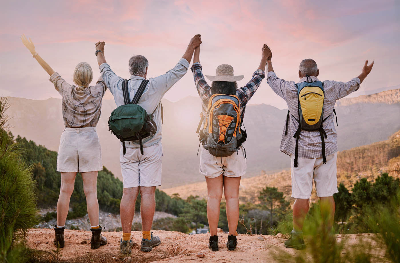 A group of older people in hiking gear celebrating the effects of contour light therapy in Scottsdale.