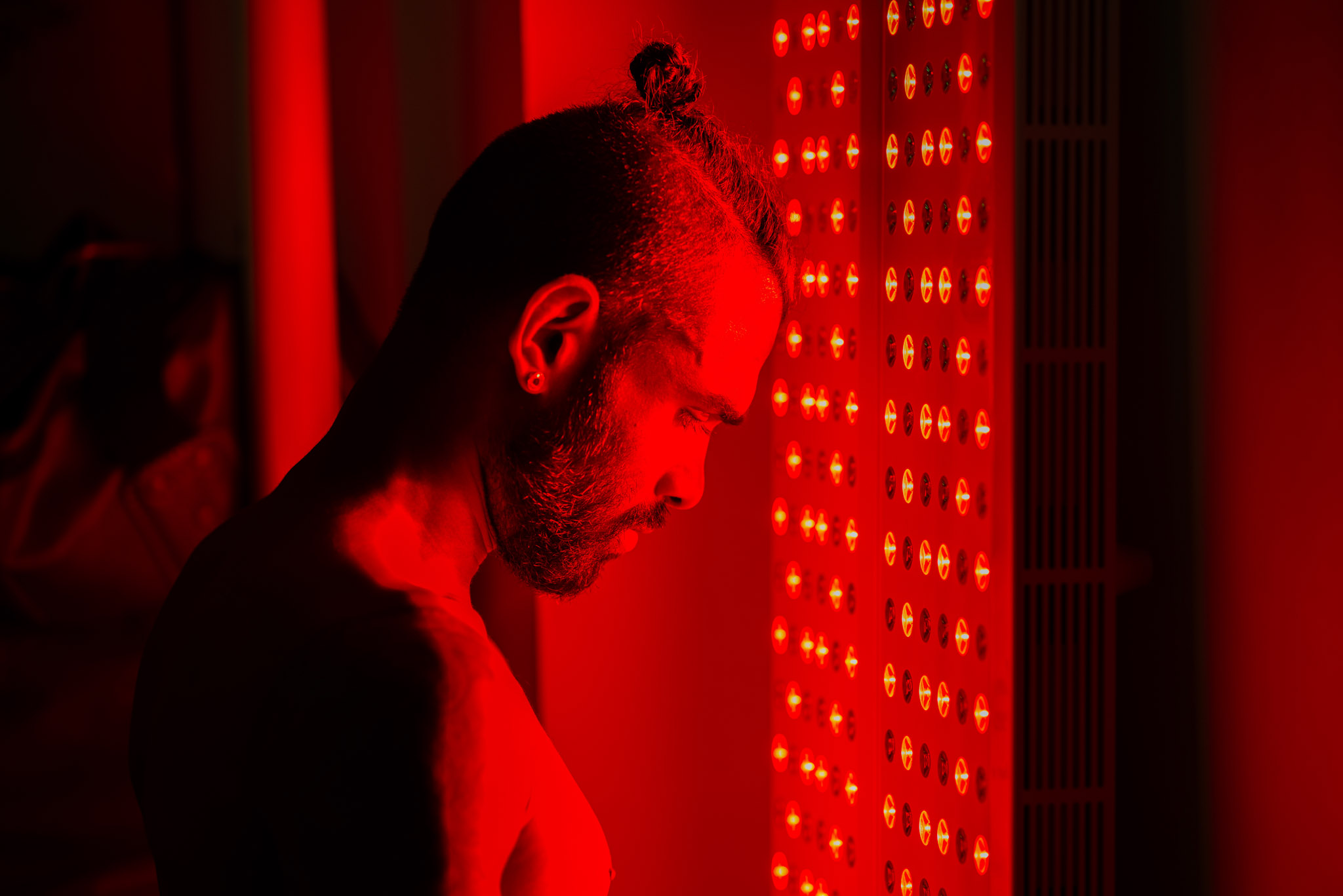 A man using an infrared sauna.
