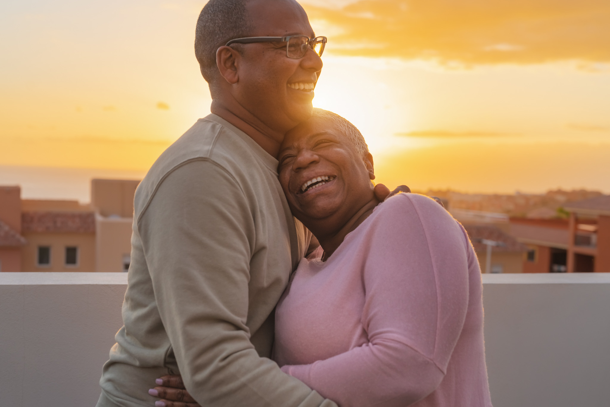 A woman and man standing outside - find relief from chronic conditions with Light Lounge's red light pain therapy in Southlake, TX.